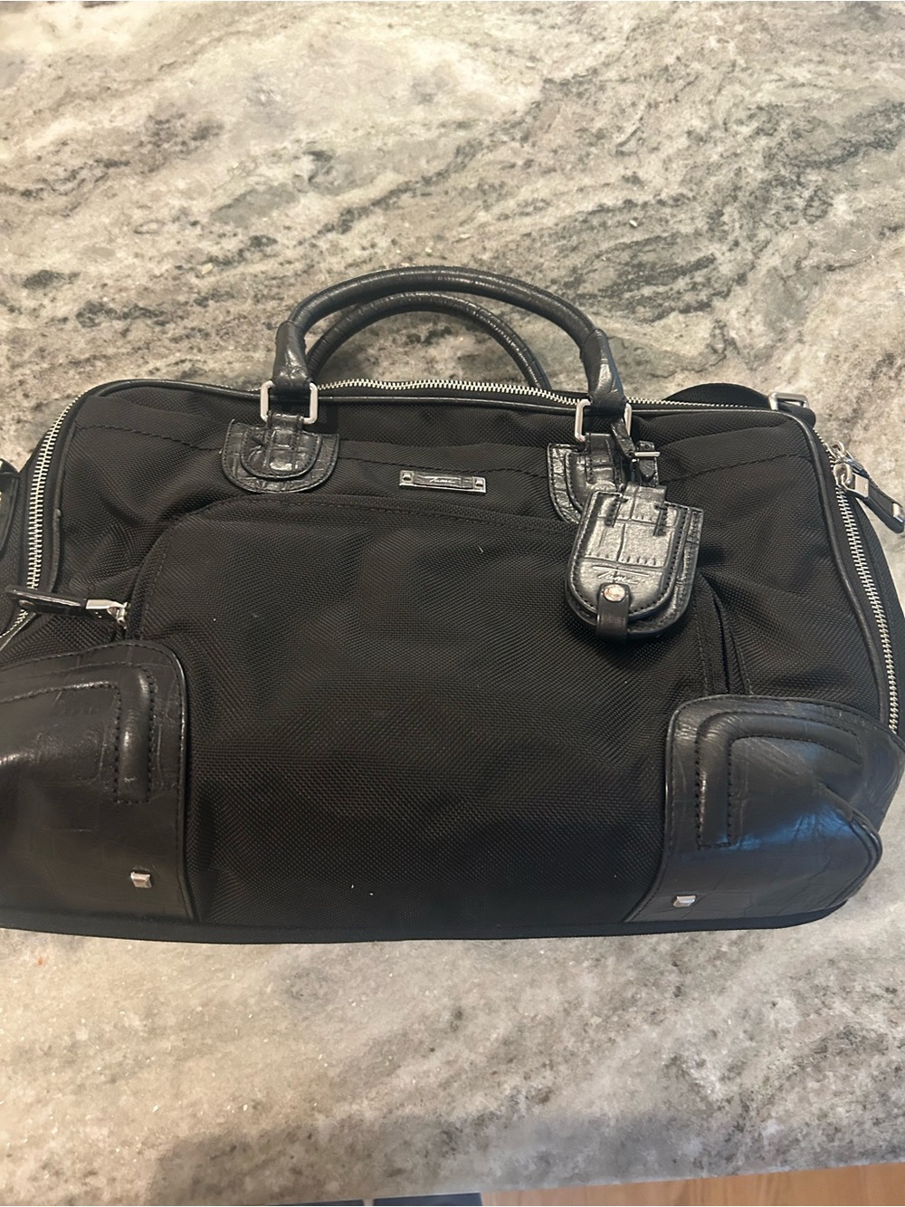 Tumi  Bag with Leather Trim
